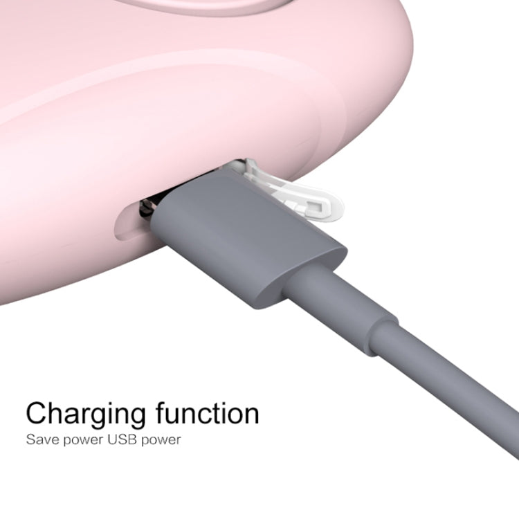 Pink personal alarm siren with charging cable connected to the USB port