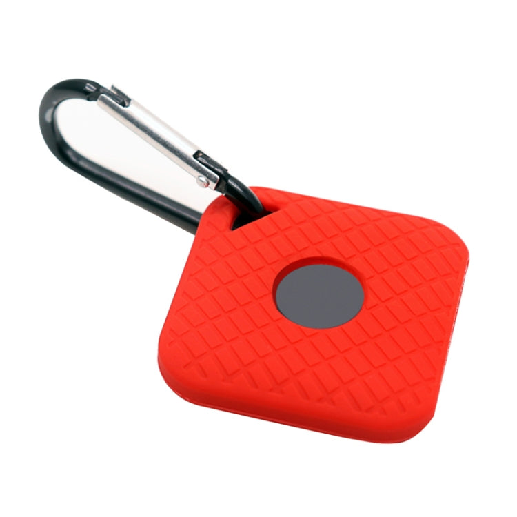 Red silicone smart tracker case with textured pattern, gray circular opening, metal clip loop