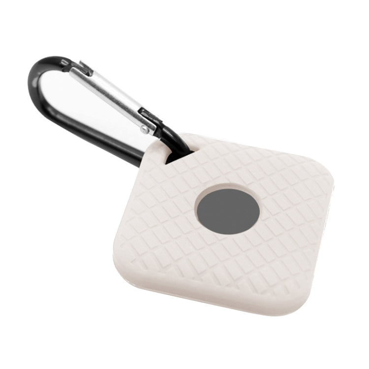 White silicone smart tracker case with textured pattern, gray circular opening, metal clip loop