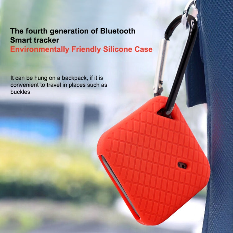 Red silicone smart tracker case with textured pattern hanging from metal carabiner clip