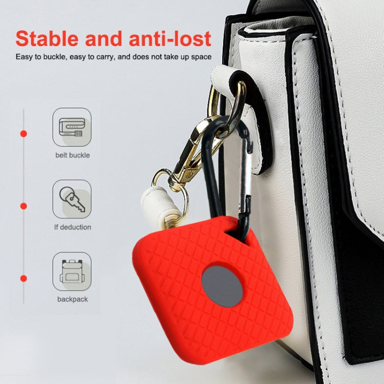 Red silicone smart tracker case attached to keyring and clips on a bag