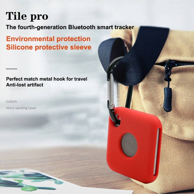 Blue silicone tracker case clipped to a bag with metal carabiner hook
