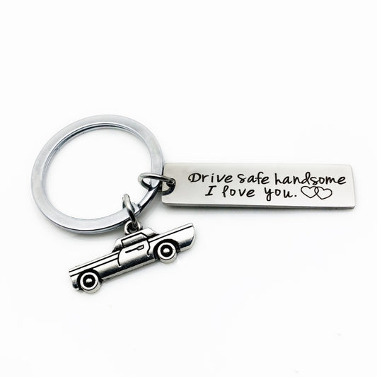Stainless steel car keychain with round ring, small car charm, and “Drive safe…” bar