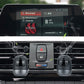 Car dashboard with black robot car air outlet aromatherapy devices attached