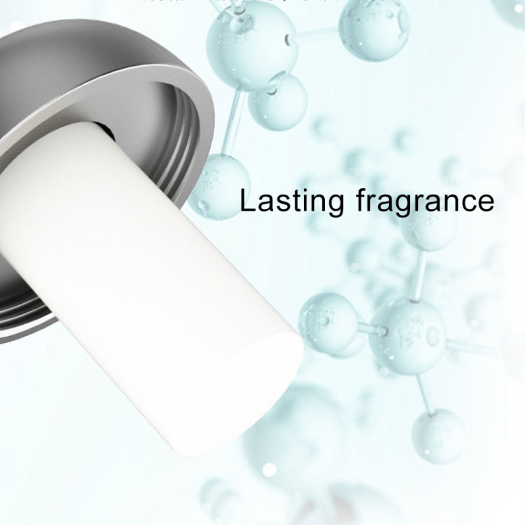 White paste applicator tube for car aromatherapy, dispensing from open nozzle