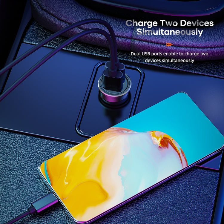 Black dual USB car charger with USB cables and smartphone connected