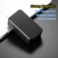 Black magnetic GPS tracker placed on a flat surface with raised base edges