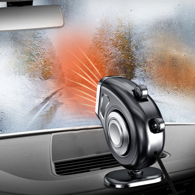Black portable car dashboard electric heater defroster aiming toward windshield on base
