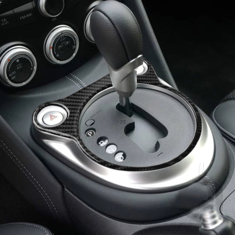 Installed carbon fiber trim sticker around gear shifter on car center console