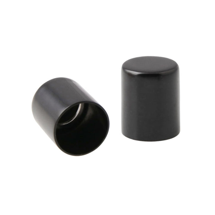 Pair of black motorcycle docking point cover caps, cylindrical with open ends