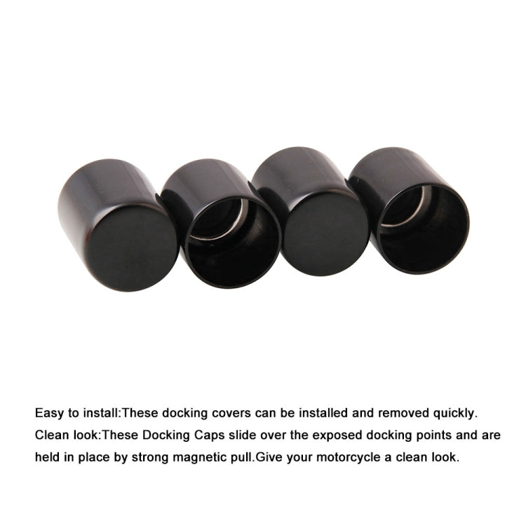 Set of four black docking point cover caps with rounded tops and open ends
