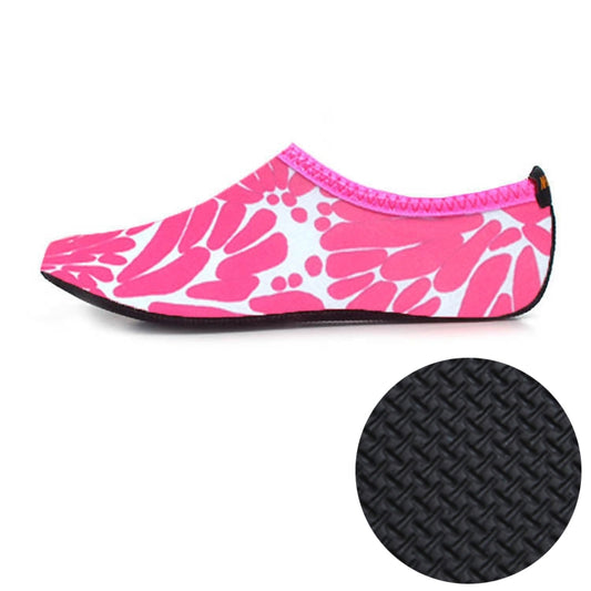 Pink patterned water shoes with stretchy ankle opening and textured rubber sole