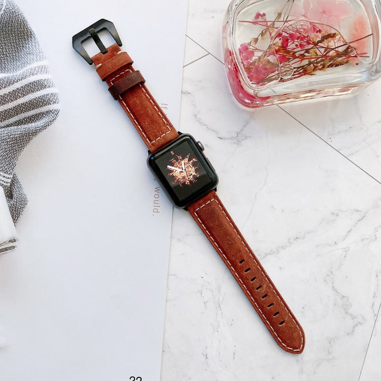 Red-brown leather buckle replacement watch band with perforated strap and metal clasp