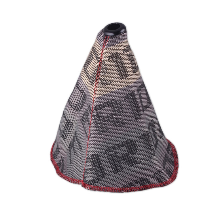 Light gray patterned shift knob dust cover with red edge stitching and round top opening