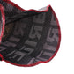 Close-up of black patterned shift knob dust cover with red trim and textured fabric