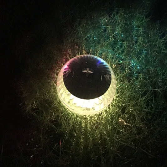 Floating solar pool light ball with warm yellow glow