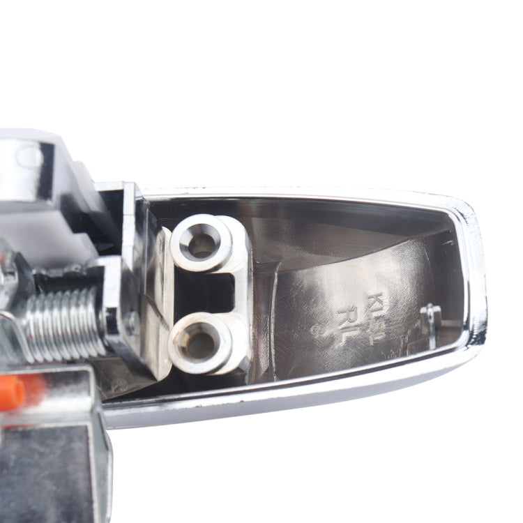 Rear left door handle mounting area with two screw bosses and markings