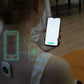 Posture sensor worn on clothing while holding a smartphone with posture reading