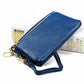 Blue zip coin purse wallet with wrist strap and keyring, side view with cards peeking out.