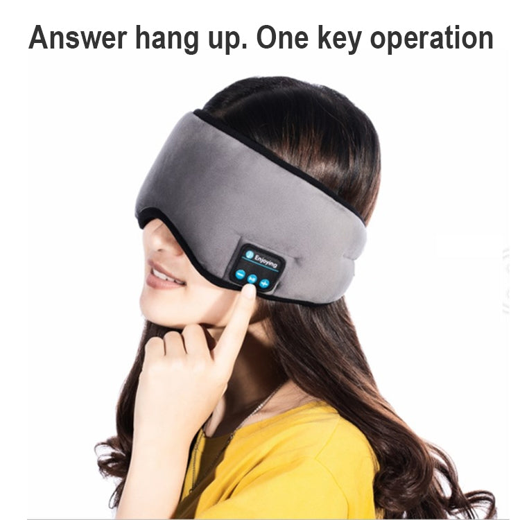 Bluetooth sleep eye mask on model, gray speaker panel with control buttons