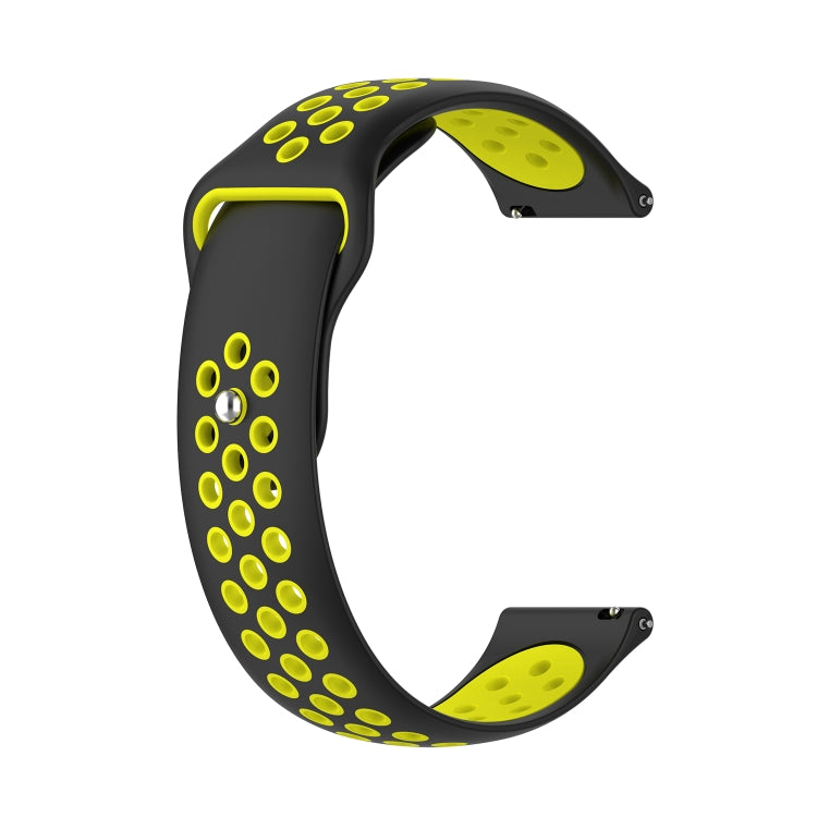 Two-tone silicone watch strap, black with yellow-green perforation dots and silver pin end.