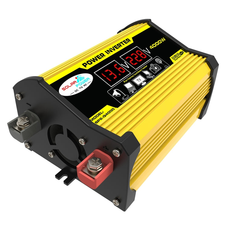 Yellow and black car power inverter close-up with LED voltmeter display and DC terminals