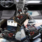 Black power inverter in vehicle interior, connected with battery clips and cables
