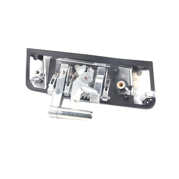 Right-side exterior door handle base, open interior with metal linkage