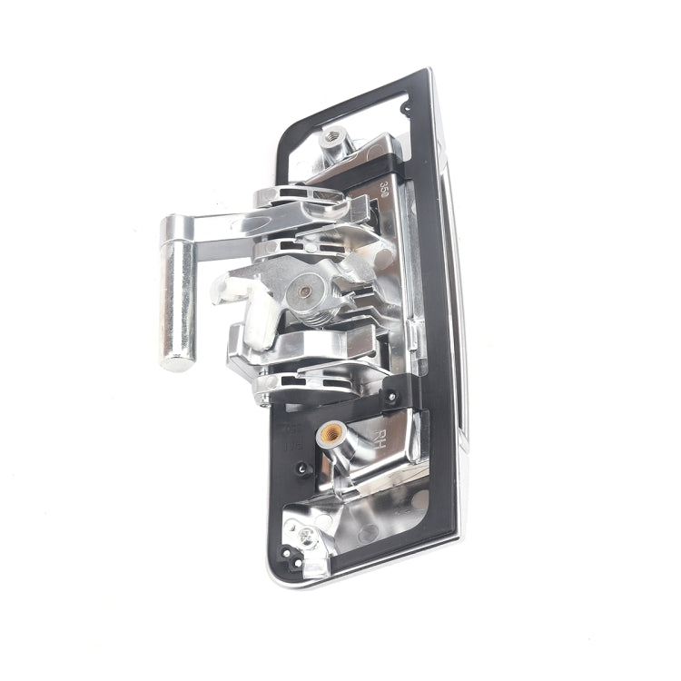 Right-side exterior door handle housing, silver frame with latch parts