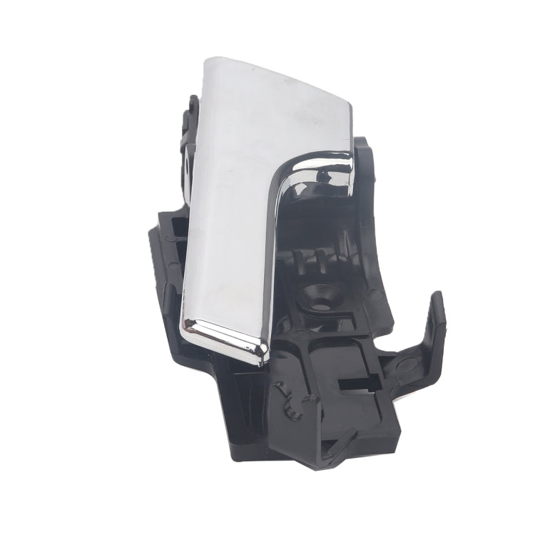 Left inside door handle showing chrome lever and black inner bracket