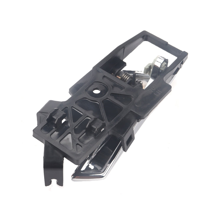 Left inside door handle side view with chrome lever and dark plastic structure