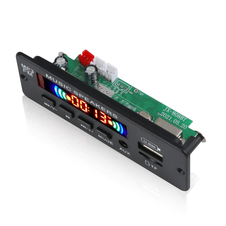 Car audio MP3 decoder board with green PCB, tuning buttons, and red/blue LED display