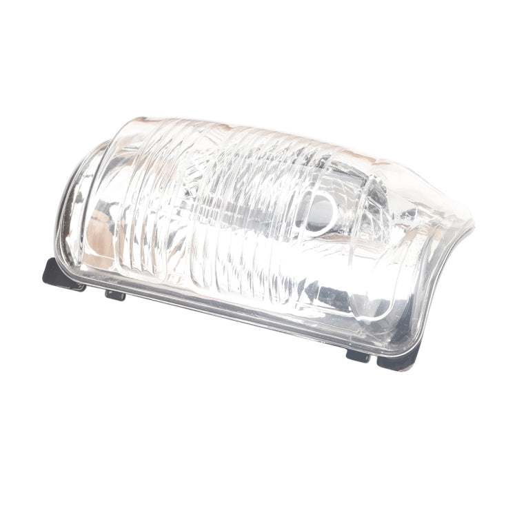 Car mirror indicator lamp cover with clear lens and black mounting base, angled front