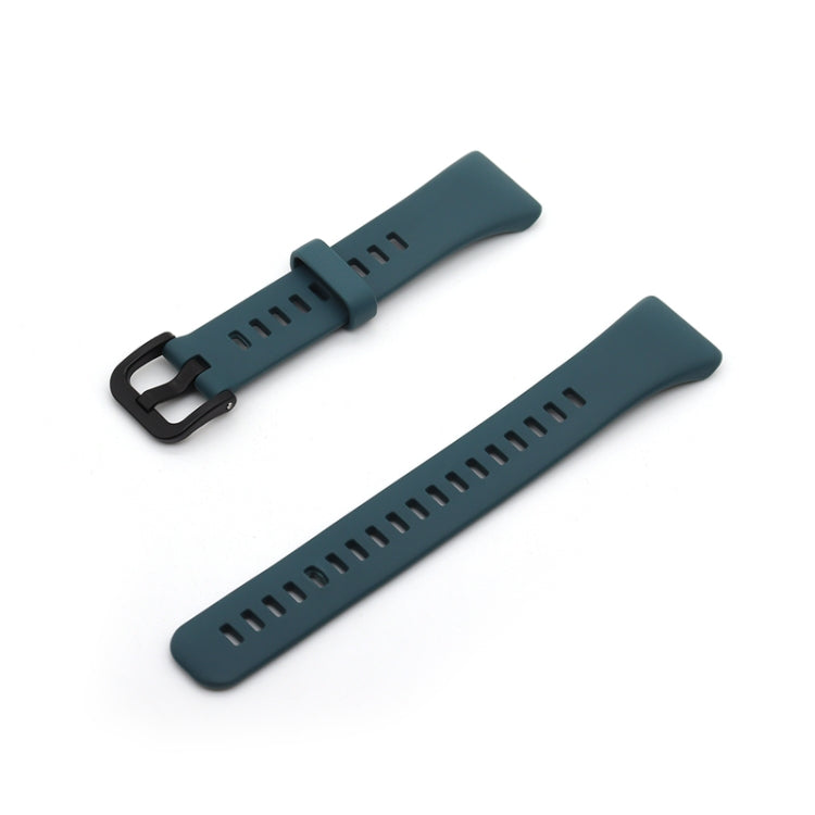 Teal silicone watch strap with black buckle and perforated sizing holes