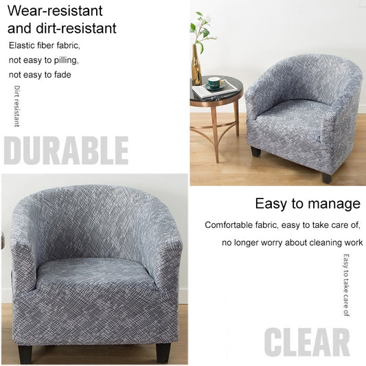 Grey geometric armchair cover on a chair, rounded back and padded seat