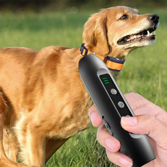 Handheld ultrasonic dog repeller with flashlight, black body, green LED indicator bars