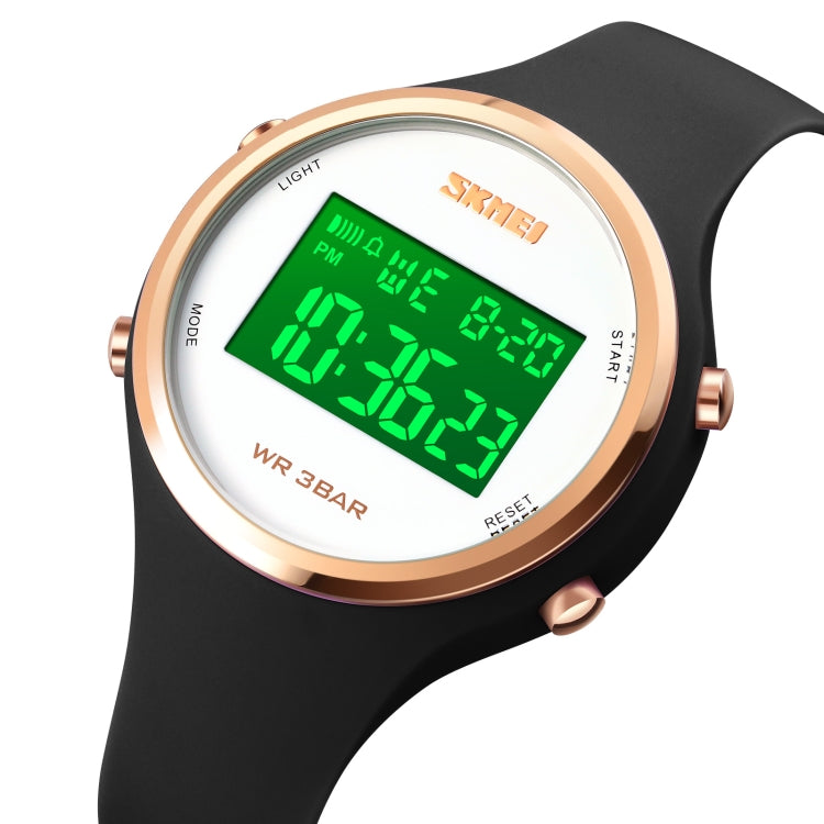 LED digital watch with black silicone strap, round rose-gold bezel, green light display