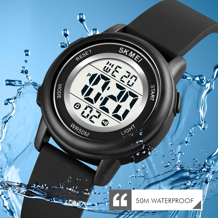 Black round LED digital watch with silicone strap, glowing numeric display