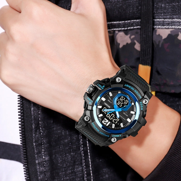 Black digital sport watch on wrist with glowing LED time display and textured strap
