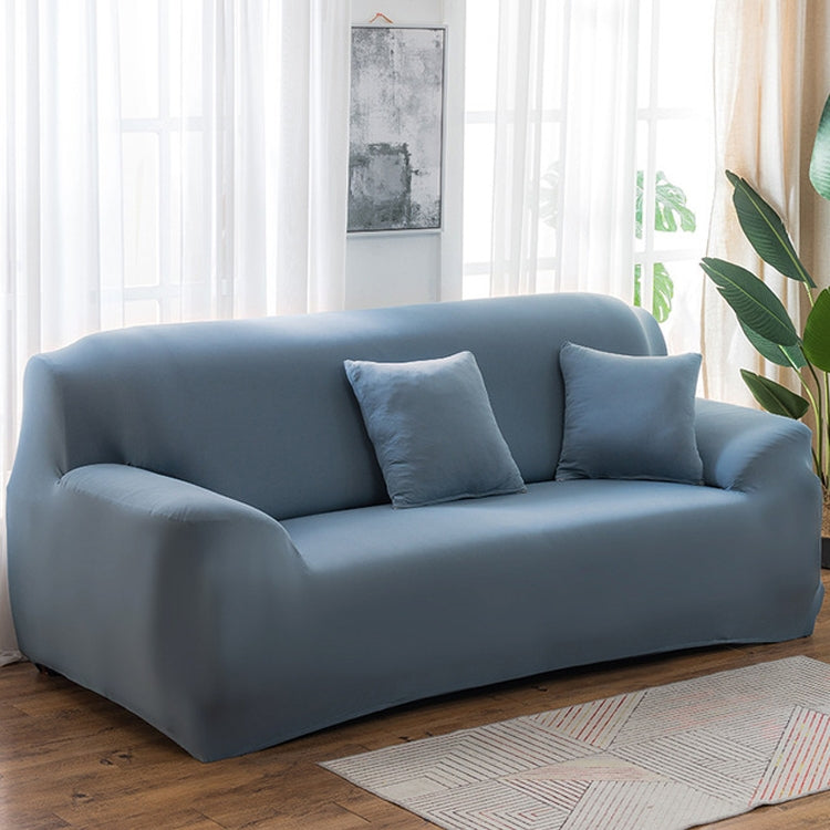 Light blue elastic full sofa cover with snug wrap over cushions and arms