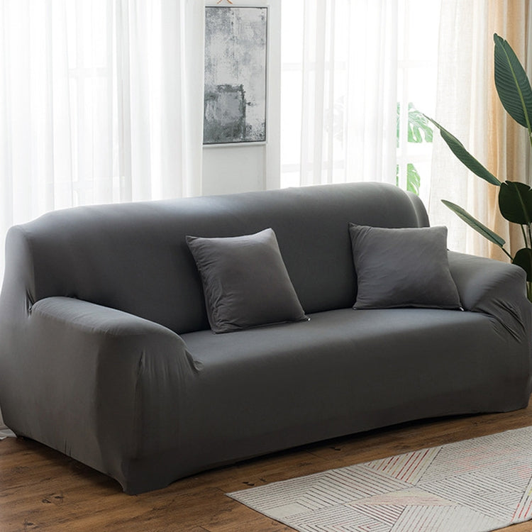 Dark gray elastic full sofa cover with snug wrap over cushions and arms