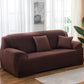 Solid-color full-coverage sofa cover in deep maroon with matching seat and back cushions