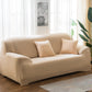 Solid-color full-coverage sofa cover in light beige with matching cushion set
