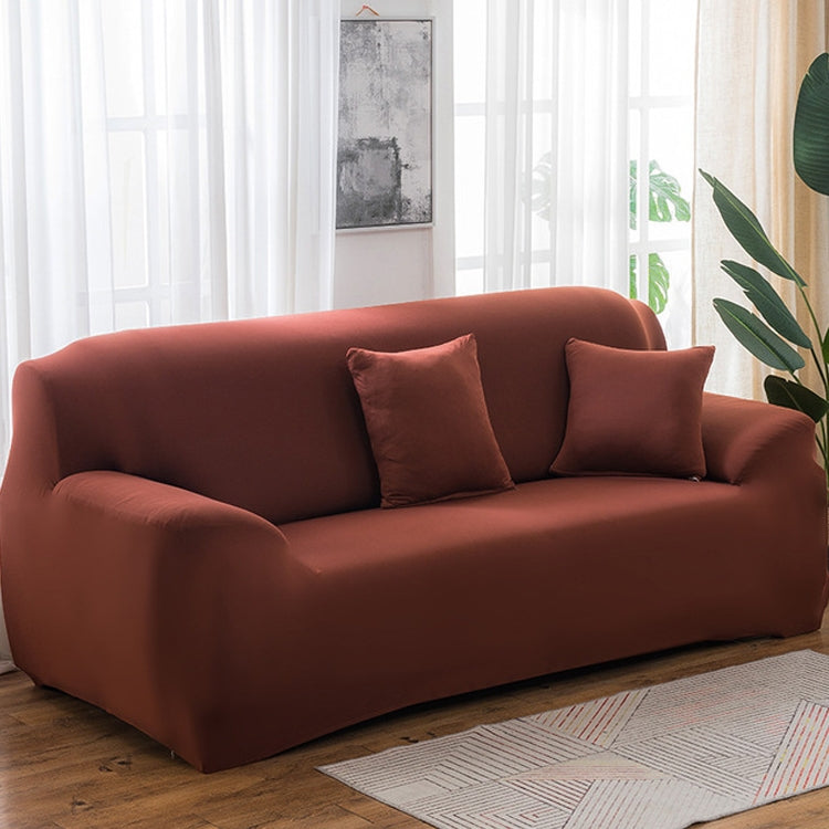 Solid-color full-coverage sofa cover in rust brown with three matching cushions