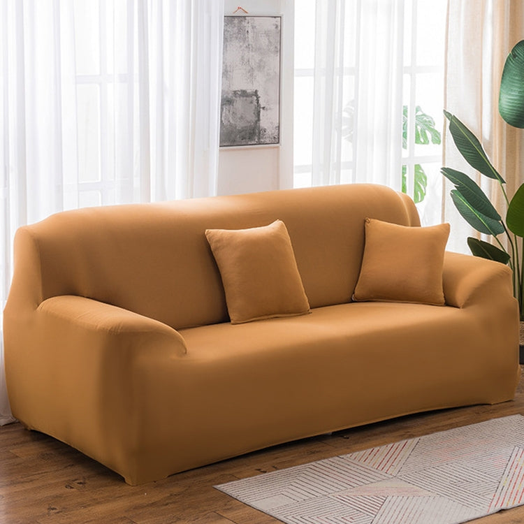 Solid-color full-coverage sofa cover in camel tan with three matching cushions