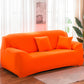 Orange elastic full-coverage sofa cover with non-slip fit, covering arms and back