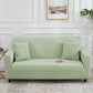 Light green elastic full-coverage sofa cover with non-slip fit, covering seat and arms