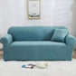 Blue-green elastic full-coverage sofa cover with non-slip fit, covering seat and arms