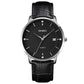 Men's quartz calendar watch with silver case, black dial, and black leather strap