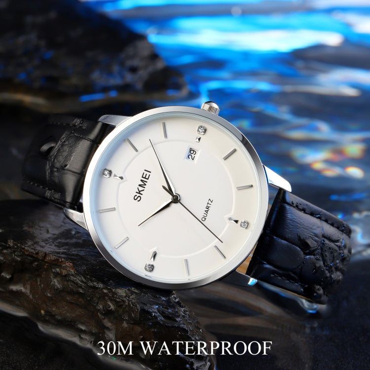 Men's quartz watch with white dial, silver case, black leather strap close-up